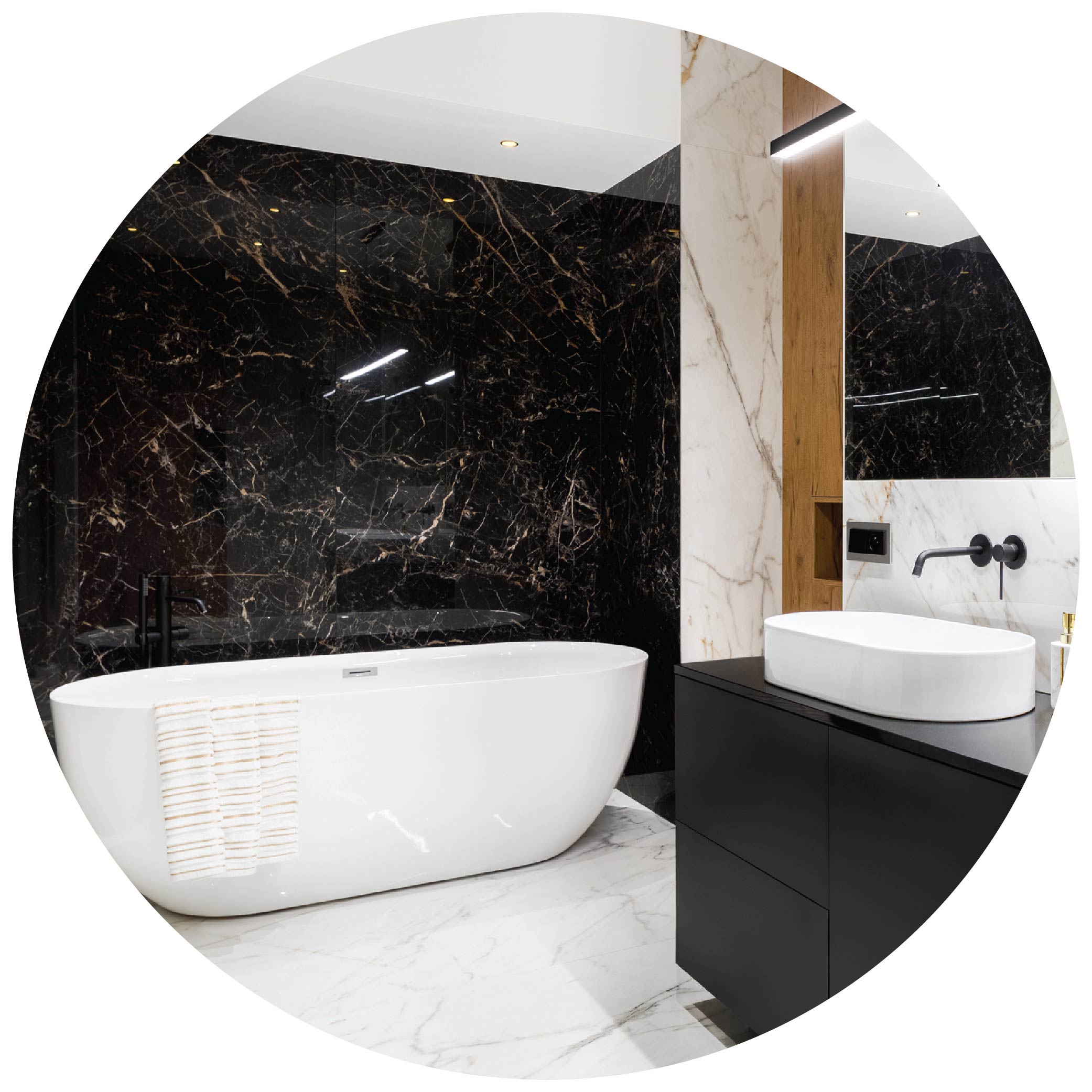 Modern bathroom with black vanity, bowl sink, and black marble accent wall behind free standing bathtub