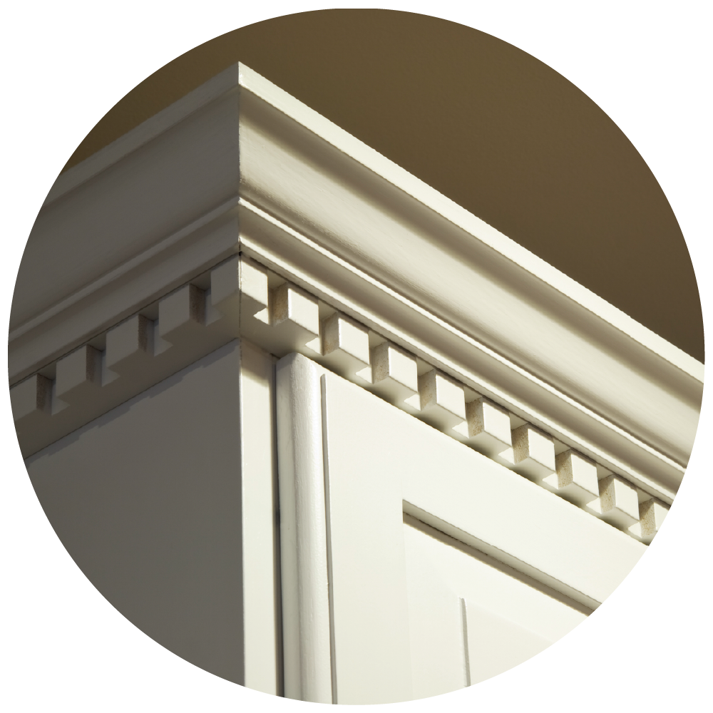 Crown moulding on off-white kitchen cabinets