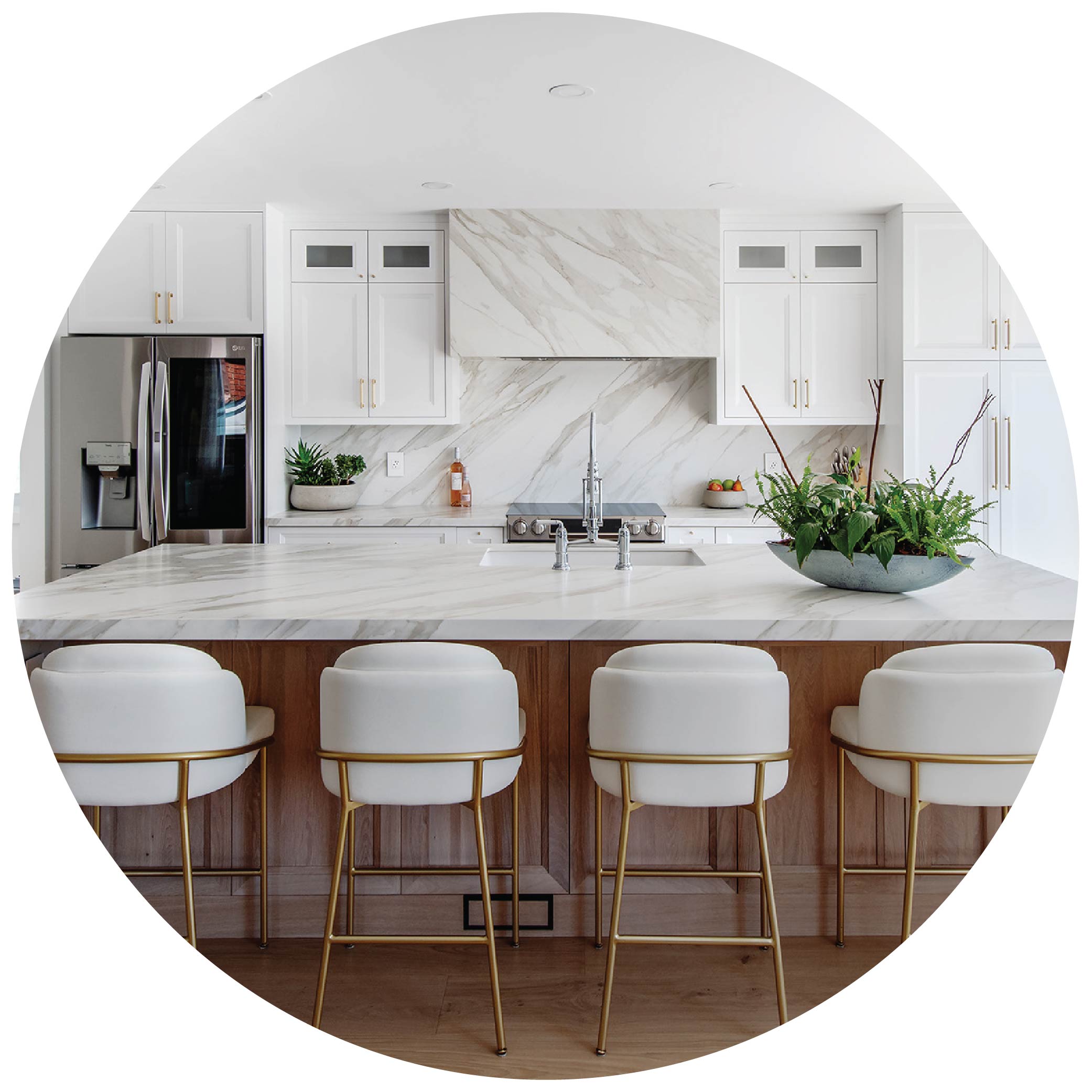 Modern white kitchen with marble countertops and hood