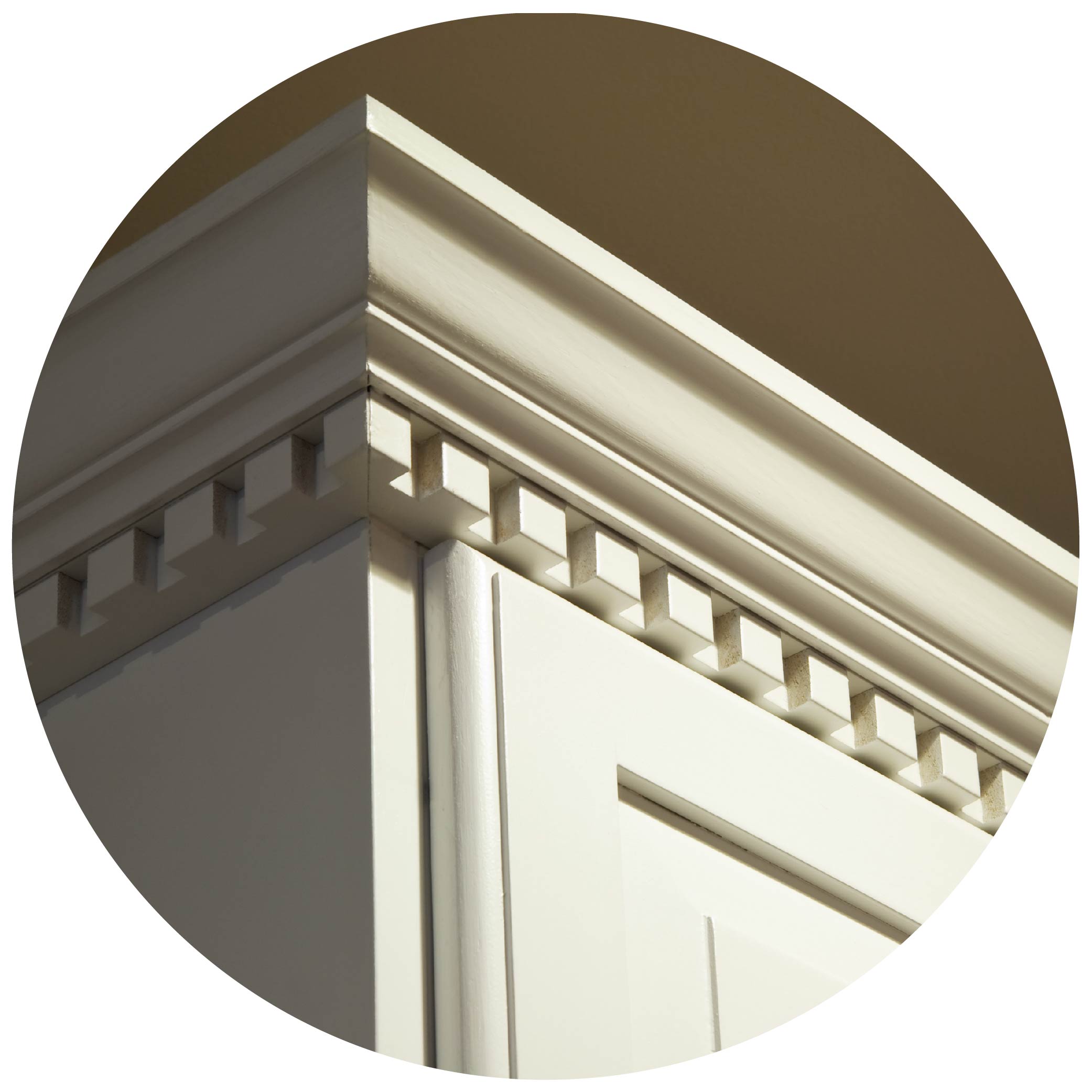 Crown moulding on off-white kitchen cabinets